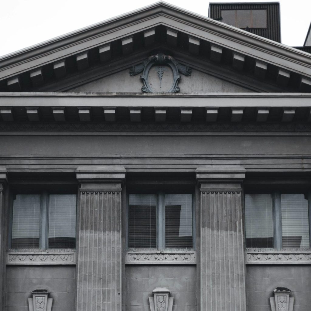 A historic bank building with classical architecture featuring the HSBC logo on its facade.