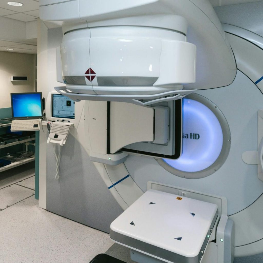 High-tech radiotherapy machine in a hospital setting, essential for cancer treatment.