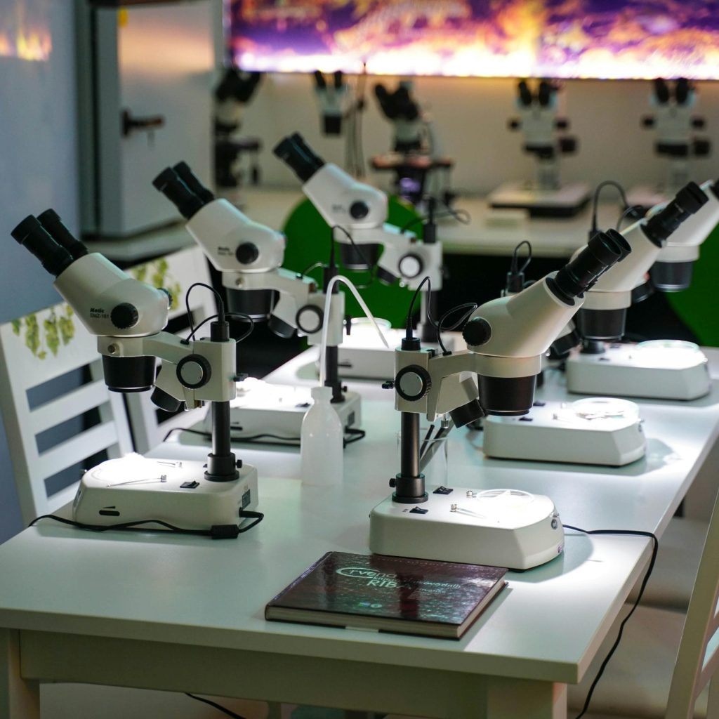 A modern laboratory full of microscopes, ready for scientific research and study.