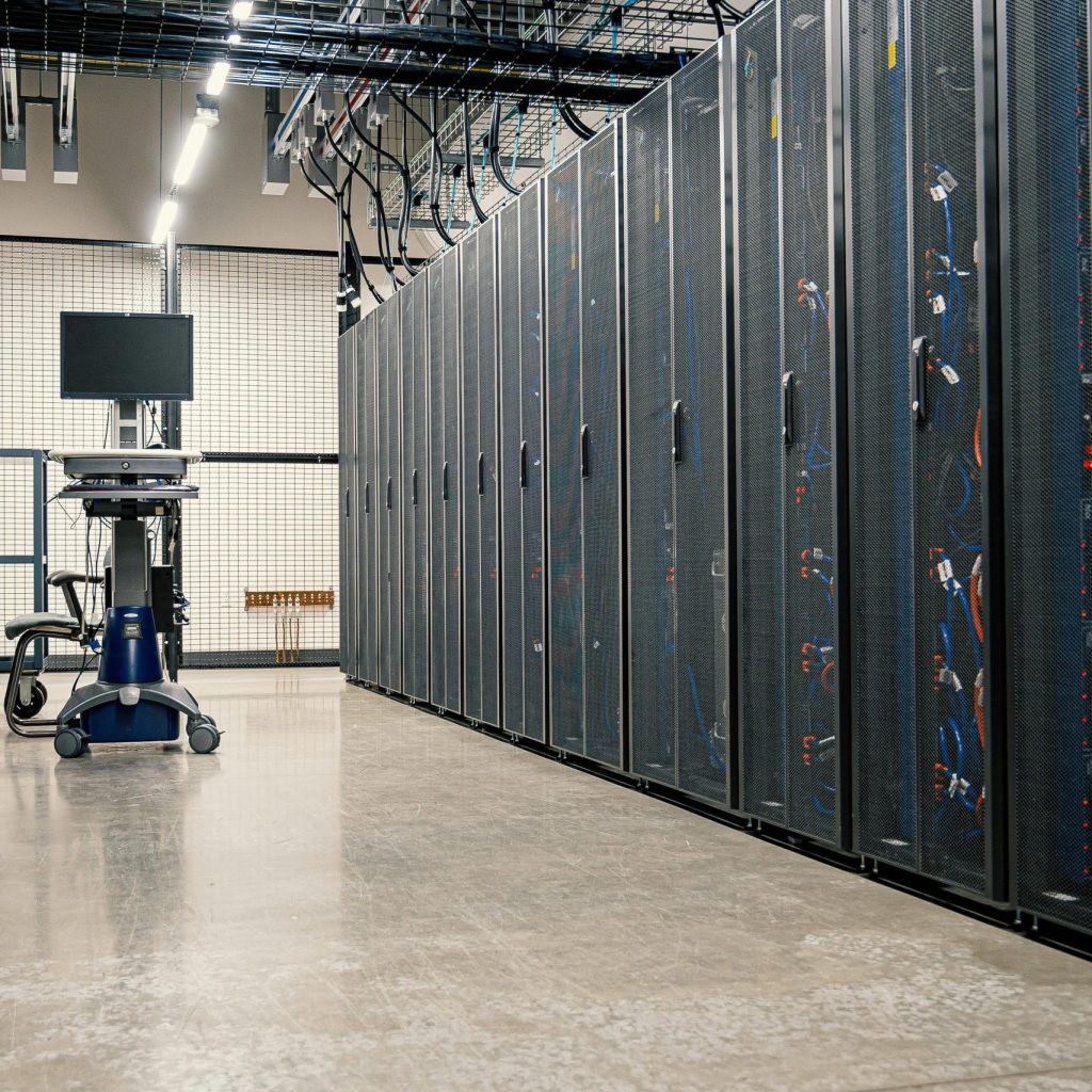 Modern data center corridor with server racks and computer equipment. Ideal for technology and IT concepts.